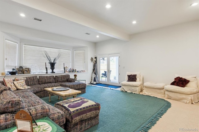 living area with carpet, beamed ceiling, visible vents, and recessed lighting