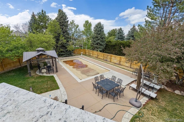 view of swimming pool with a gazebo, a patio area, a fenced backyard, a lawn, and outdoor dining area