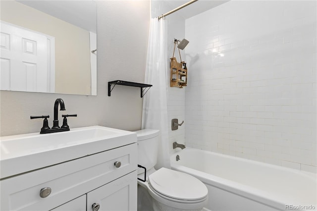 full bathroom with shower / tub combo, vanity, and toilet