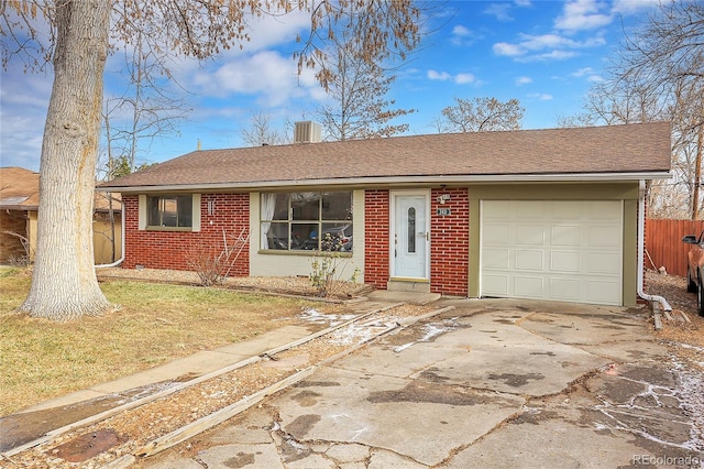 ranch-style home featuring central AC, a front lawn, and a garage