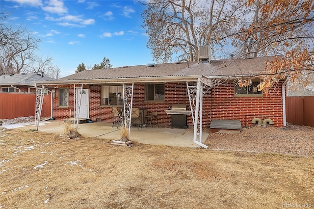 back of property featuring a patio area