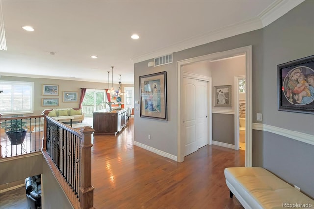 hall featuring recessed lighting, baseboards, visible vents, and wood finished floors