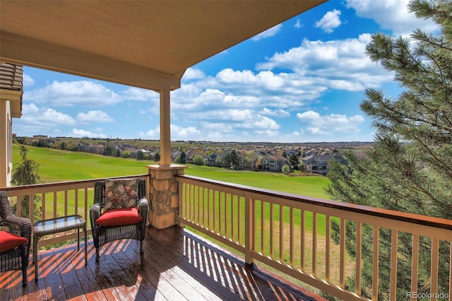 wooden terrace featuring a lawn and golf course view