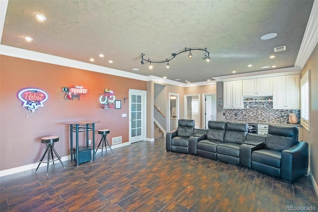 living room featuring baseboards, recessed lighting, dark wood-style flooring, crown molding, and stairs
