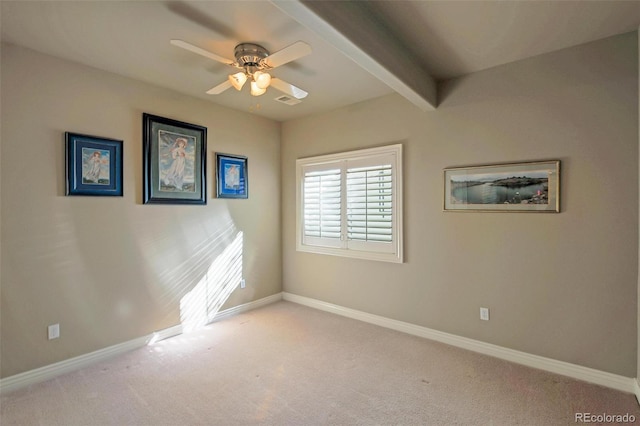 empty room featuring carpet floors, baseboards, and ceiling fan
