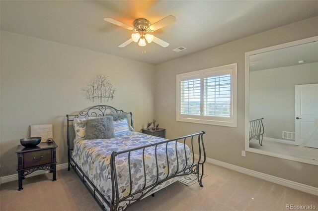 bedroom with baseboards, carpet flooring, and visible vents