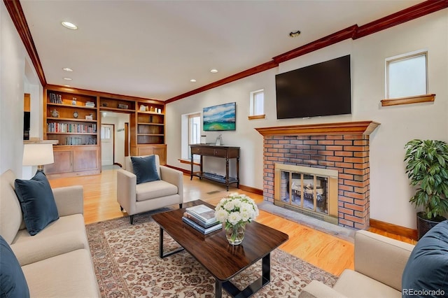 458 S Downing St, Denver, CO 80209 - living area featuring crown molding, wood finished floors, a brick fireplace, baseboards, and recessed lighting