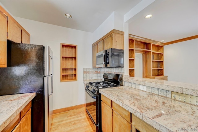 458 S Downing St, Denver, CO 80209 - kitchen featuring stainless steel appliances, light wood-style floors, decorative backsplash, baseboards, and open shelves