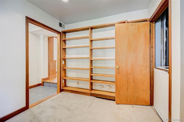 458 S Downing St, Denver, CO 80209 - unfurnished bedroom featuring carpet flooring, baseboards, and washer / dryer