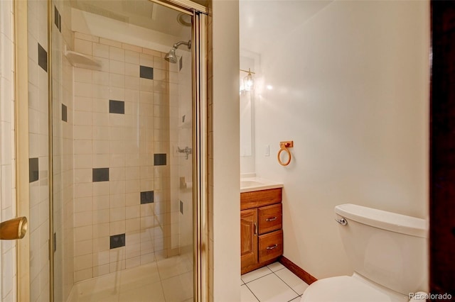 458 S Downing St, Denver, CO 80209 - bathroom featuring toilet, tile patterned floors, a stall shower, and vanity