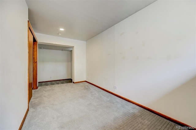 458 S Downing St, Denver, CO 80209 - unfurnished bedroom with light colored carpet, baseboards, and recessed lighting