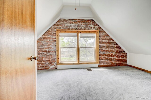 458 S Downing St, Denver, CO 80209 - additional living space with carpet, vaulted ceiling, brick wall, and baseboards