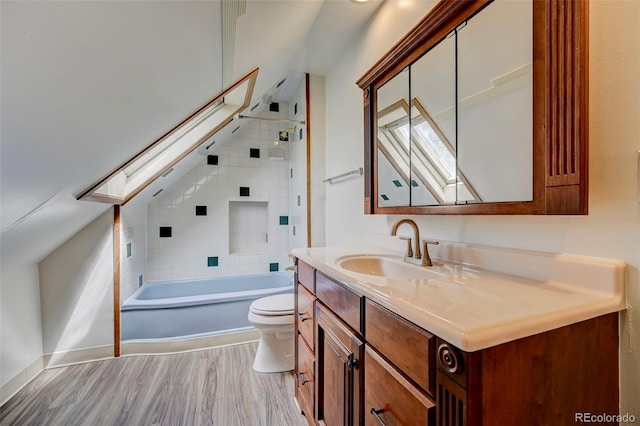 458 S Downing St, Denver, CO 80209 - bathroom with a skylight, toilet, vanity, tub / shower combination, and wood finished floors