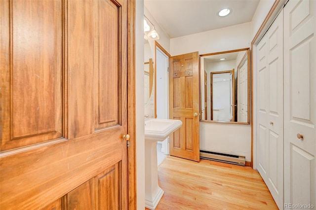 458 S Downing St, Denver, CO 80209 - corridor with baseboard heating, light wood-type flooring, and recessed lighting