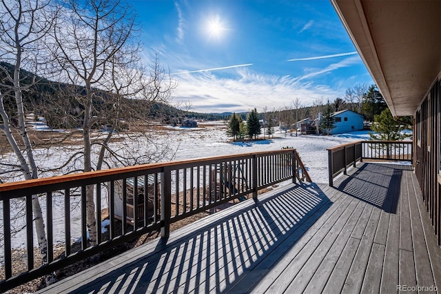 view of snow covered deck