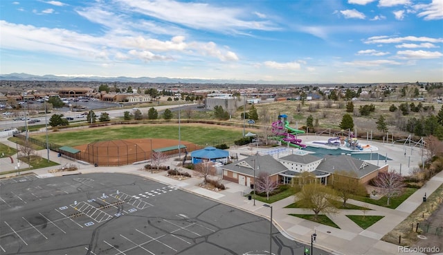birds eye view of property featuring a mountain view