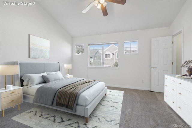 carpeted bedroom with lofted ceiling and ceiling fan