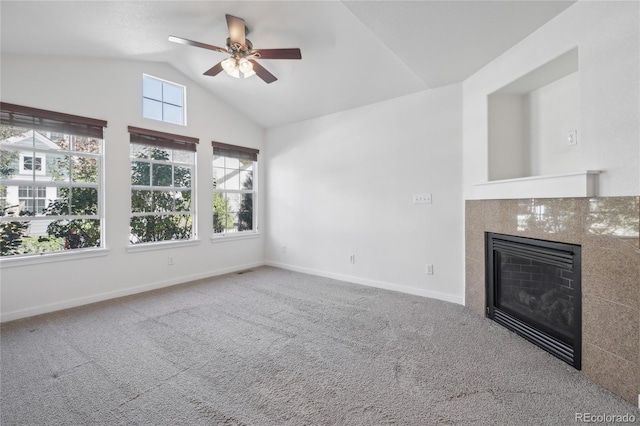 unfurnished living room with ceiling fan, carpet, and lofted ceiling