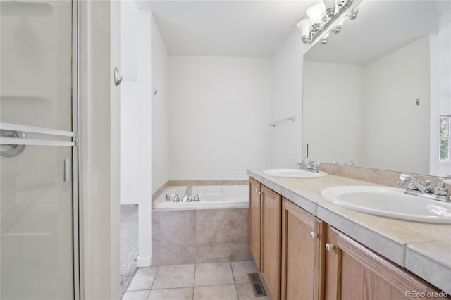 bathroom with vanity, shower with separate bathtub, and tile patterned floors