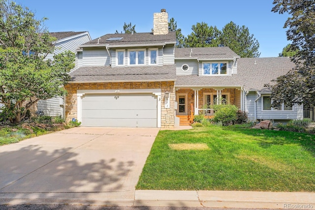 8505 E Temple Dr Unit 473, Denver, CO 80237 - view of front of home with covered porch, concrete driveway, a front yard, a garage, and a chimney