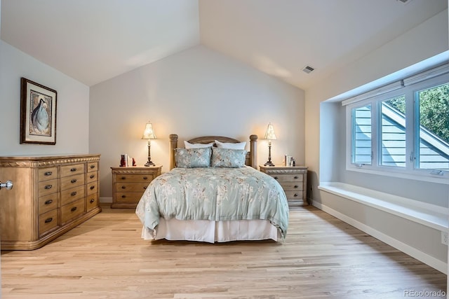 8505 E Temple Dr Unit 473, Denver, CO 80237 - bedroom featuring light wood-style flooring and lofted ceiling