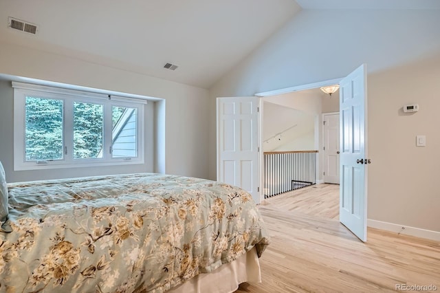 8505 E Temple Dr Unit 473, Denver, CO 80237 - bedroom with lofted ceiling and light wood-type flooring