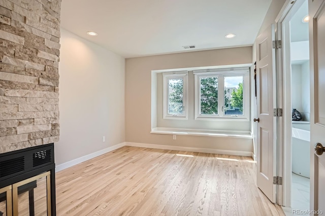 8505 E Temple Dr Unit 473, Denver, CO 80237 - unfurnished living room featuring light wood-style flooring and recessed lighting