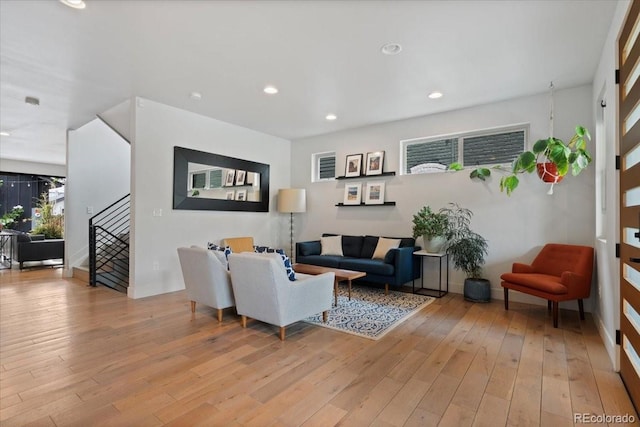 2533 N Emerson St, Denver, CO 80205 - living area featuring light wood-style flooring, stairway, and recessed lighting