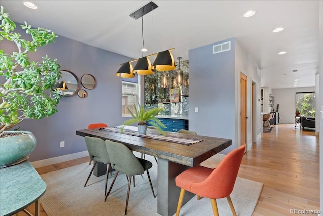 2533 N Emerson St, Denver, CO 80205 - dining room featuring light wood-style floors, recessed lighting, and baseboards