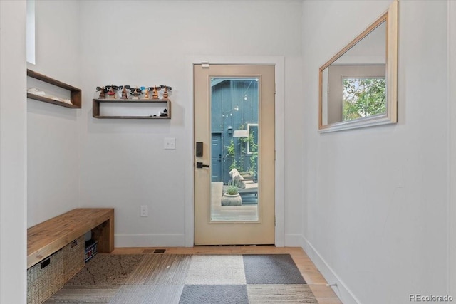 2533 N Emerson St, Denver, CO 80205 - doorway to outside with baseboards and wood finished floors