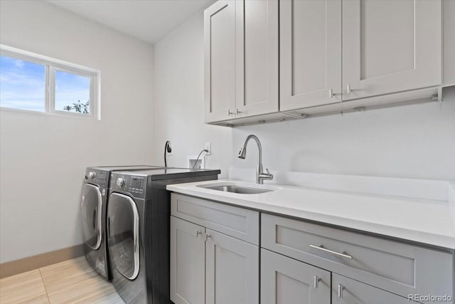 2533 N Emerson St, Denver, CO 80205 - washroom with washer and dryer, cabinet space, and baseboards