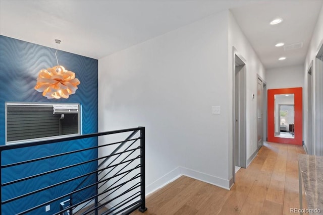 2533 N Emerson St, Denver, CO 80205 - hallway with an upstairs landing, a chandelier, wood finished floors, baseboards, and recessed lighting