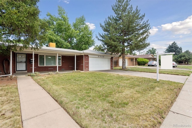 3030 S University Blvd, Denver, CO 80210 - ranch-style house featuring an attached garage, brick siding, a front yard, driveway, and a porch