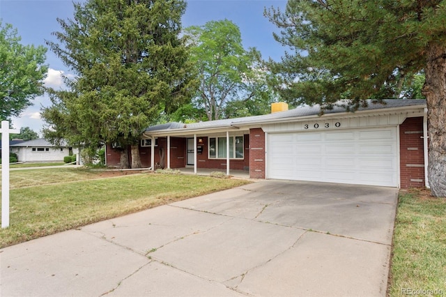 3030 S University Blvd, Denver, CO 80210 - single story home featuring brick siding, a garage, a front yard, driveway, and a porch