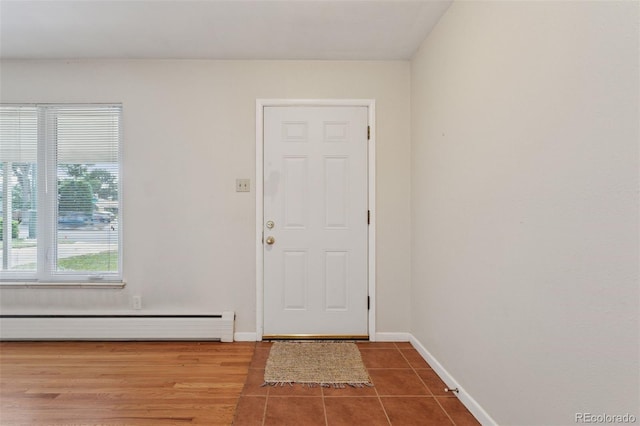 3030 S University Blvd, Denver, CO 80210 - foyer featuring baseboard heating and tile patterned flooring