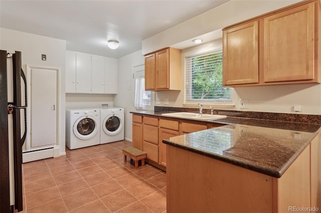 3030 S University Blvd, Denver, CO 80210 - laundry area featuring washing machine and clothes dryer, light tile patterned flooring, and a baseboard radiator