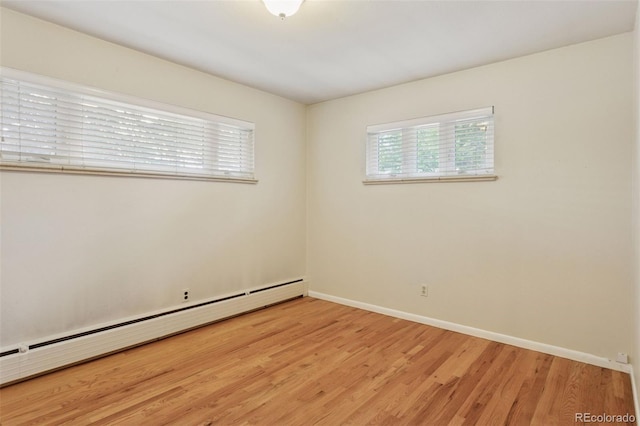 3030 S University Blvd, Denver, CO 80210 - spare room featuring baseboard heating and light wood-type flooring