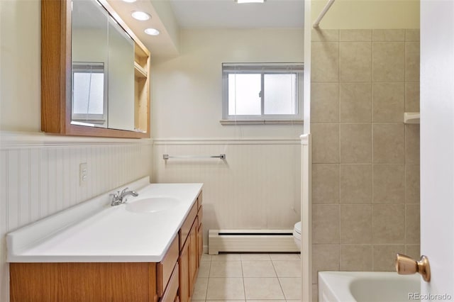 3030 S University Blvd, Denver, CO 80210 - bathroom featuring baseboard heating, vanity, tile patterned flooring, a wainscoted wall, and bathing tub / shower combination