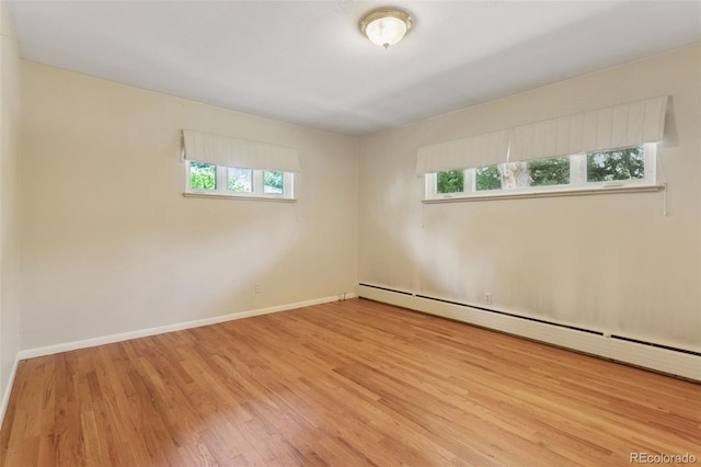 3030 S University Blvd, Denver, CO 80210 - spare room with baseboard heating and wood finished floors