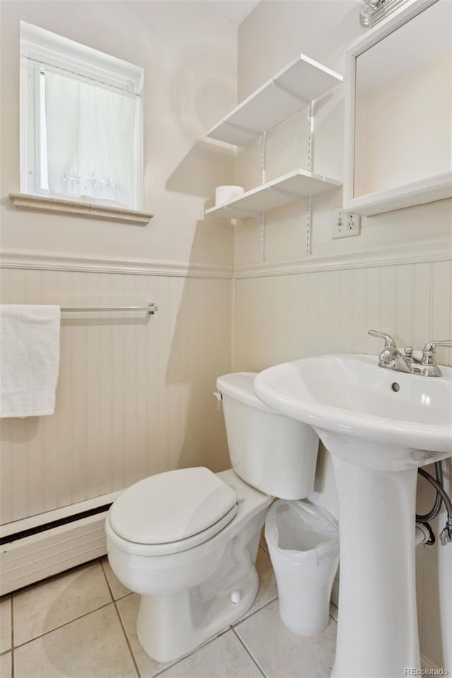 3030 S University Blvd, Denver, CO 80210 - bathroom featuring baseboard heating, wainscoting, and tile patterned floors