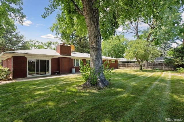 3030 S University Blvd, Denver, CO 80210 - view of yard featuring a patio