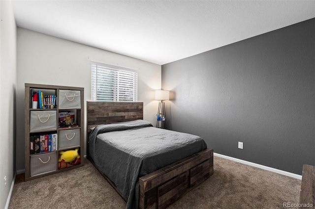 carpeted bedroom with baseboards