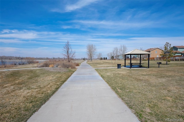 view of property's community with a gazebo and a yard