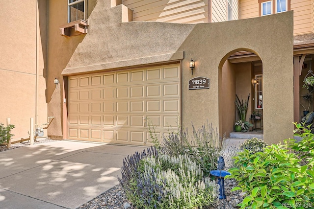 11839 E Fair Ave, Greenwood Village, CO 80111 - garage with concrete driveway and cooling unit