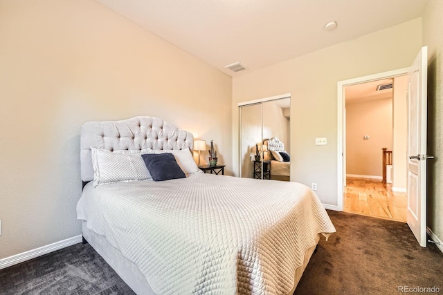 11839 E Fair Ave, Greenwood Village, CO 80111 - bedroom with dark colored carpet and a closet