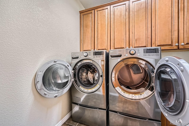11839 E Fair Ave, Greenwood Village, CO 80111 - laundry room with cabinet space, independent washer and dryer, and a textured wall