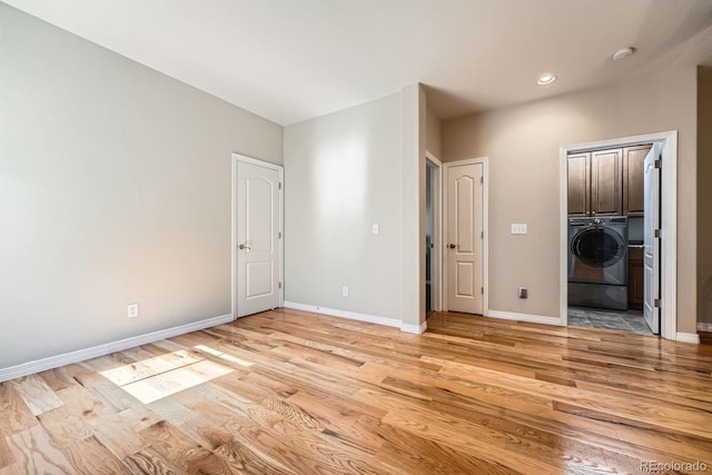 11839 E Fair Ave, Greenwood Village, CO 80111 - unfurnished bedroom featuring washer / clothes dryer, light wood finished floors, and recessed lighting