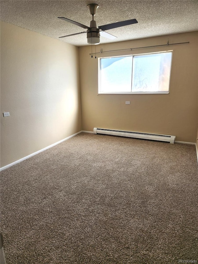 carpeted spare room featuring a baseboard radiator, baseboards, a textured ceiling, and a ceiling fan