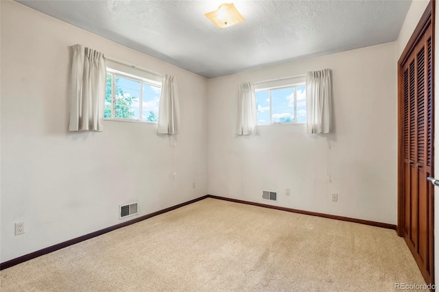 1803 Graves Ct, Northglenn, CO 80233 - unfurnished bedroom featuring carpet flooring, a closet, and a textured ceiling