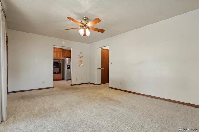 1803 Graves Ct, Northglenn, CO 80233 - spare room with light colored carpet and a ceiling fan
